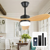 Ceiling fan with wooden blades in a room with a table and chairs.